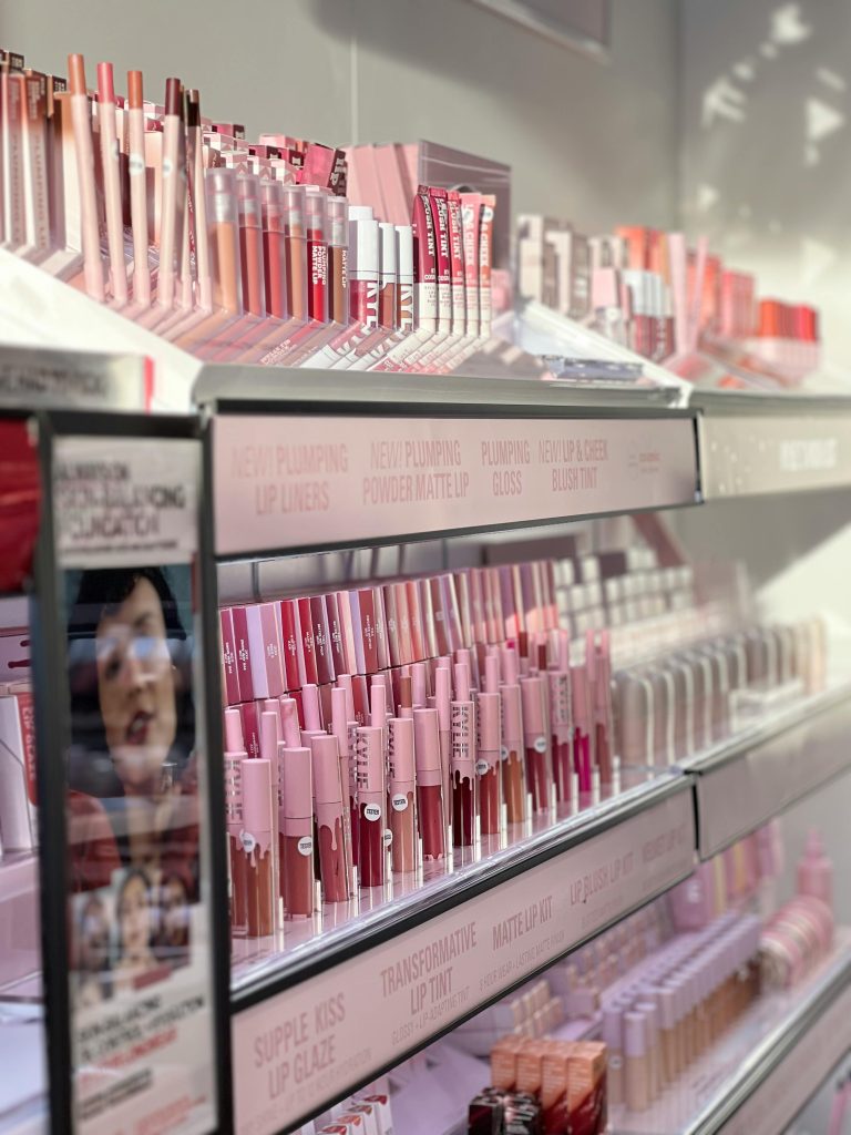 Vivid display of various lip products on shelves. Perfect for beauty and retail concepts.